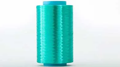 A cylindrical spool of shiny turquoise thread with blue plastic caps on both ends, shown on a plain white background.