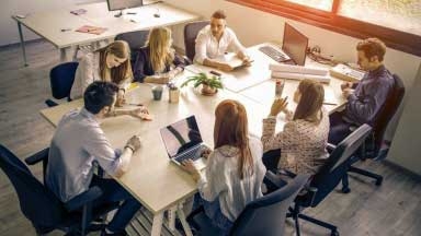 People around a desk